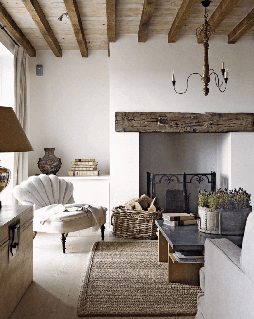 A modern farmhouse living room with a white reading chair and a fireplace