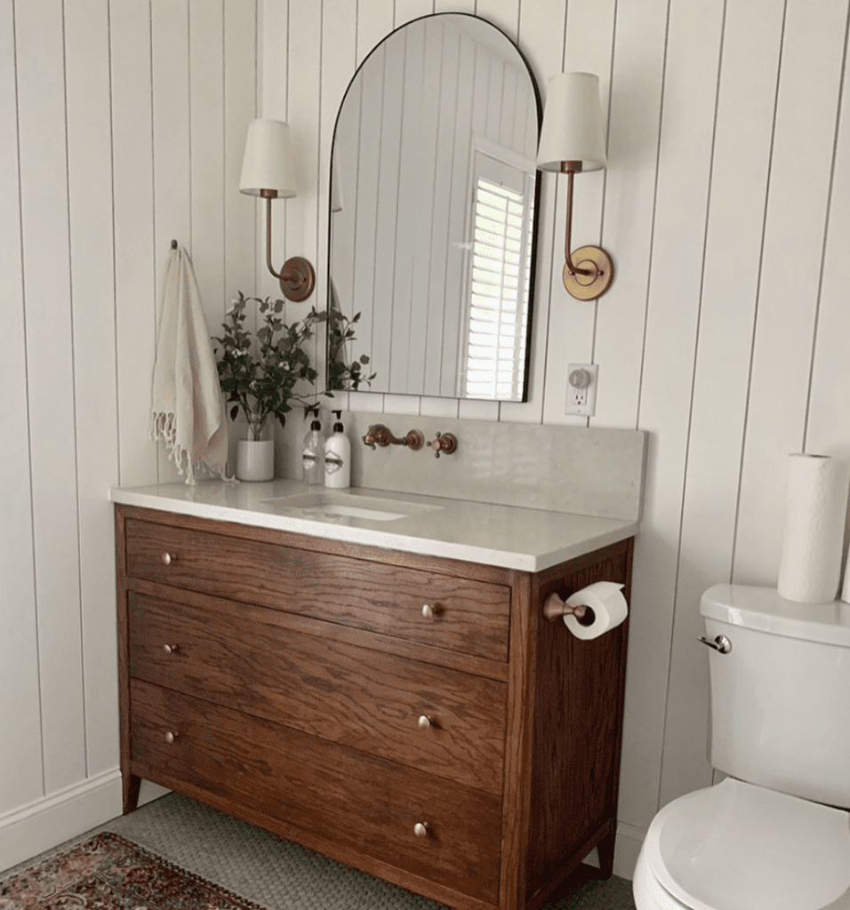 bathroom vanity with side-mounted toilet paper holder to maximize space