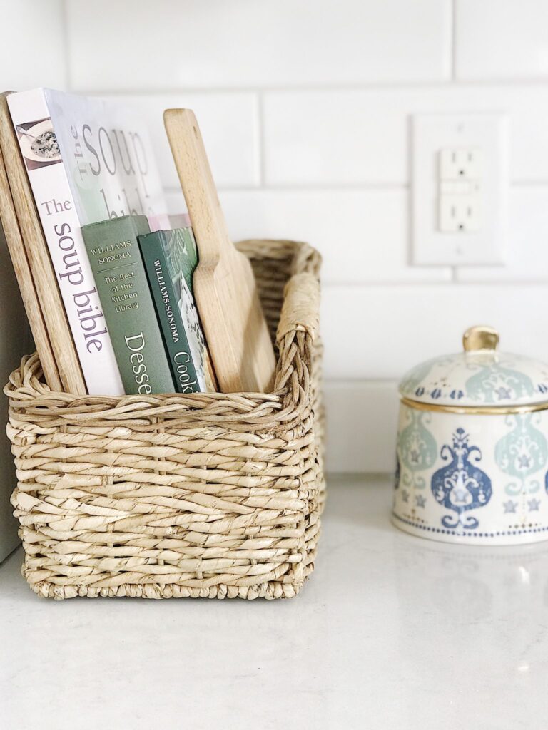 Decorative wicker basket containing books 