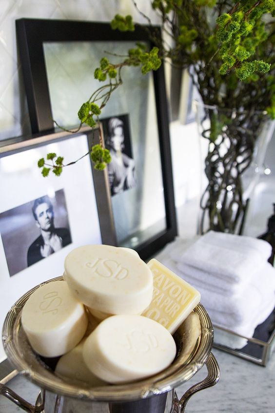 vintage silver bowl with collection of soap bars for guest bathroom