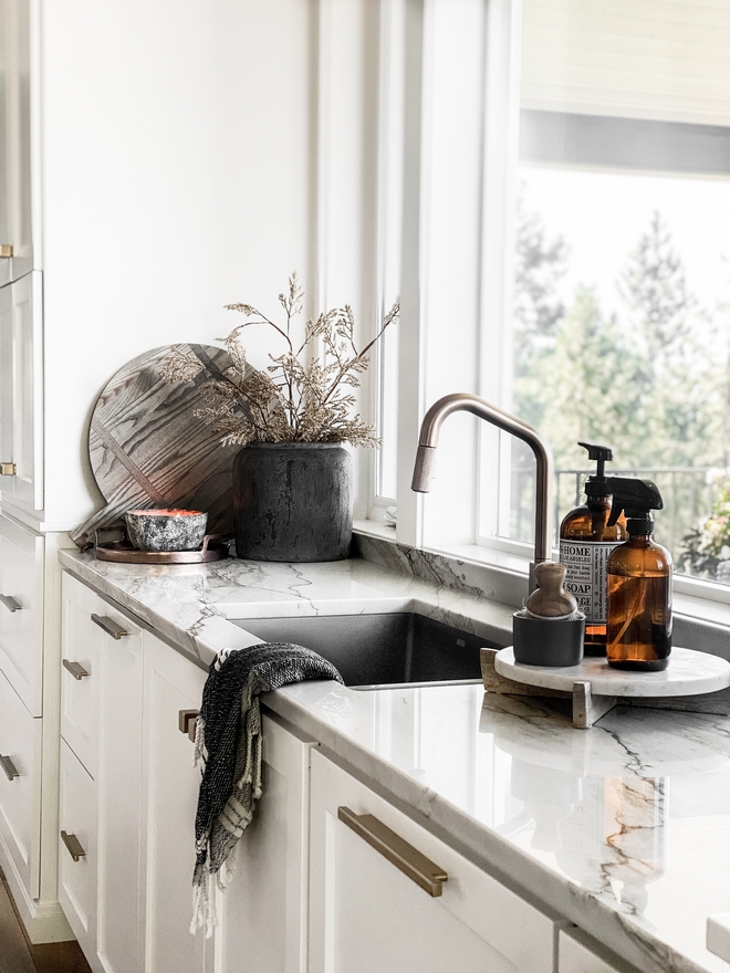 Kitchen sink with a marble tray for dish soap