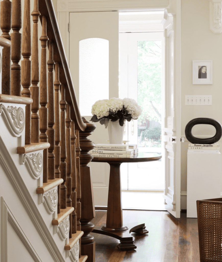 Classic entryway to show how to use a roundtable for decor near the main door