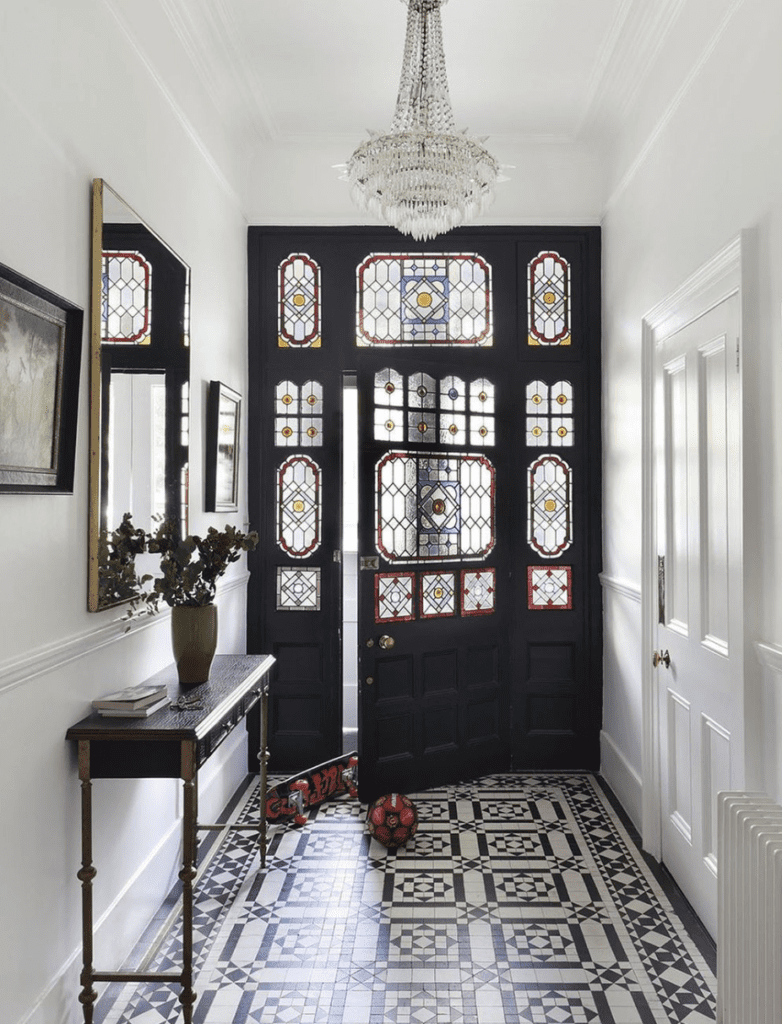 Victorian-style entryway with geometrical tiles on the floor