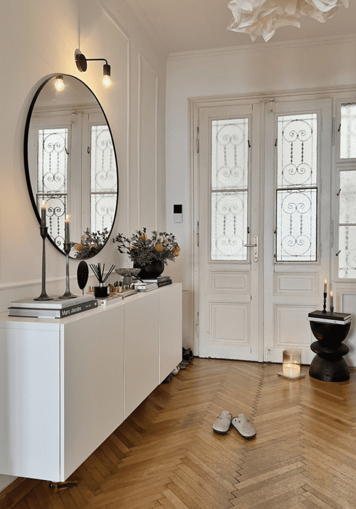 Modern and chic entrance used to showcase how to style a floating dresser in a classic environment