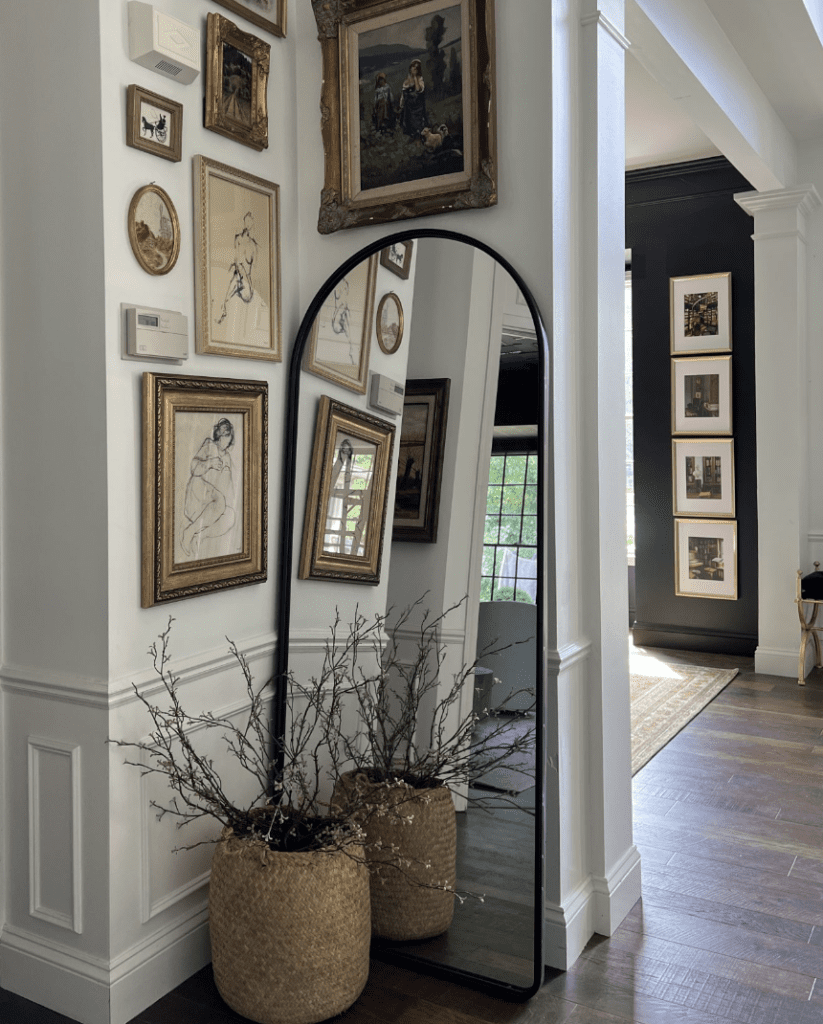 Full-length mirror leaning against the wall in the small entryway to provide an idea on how to decor small spaces