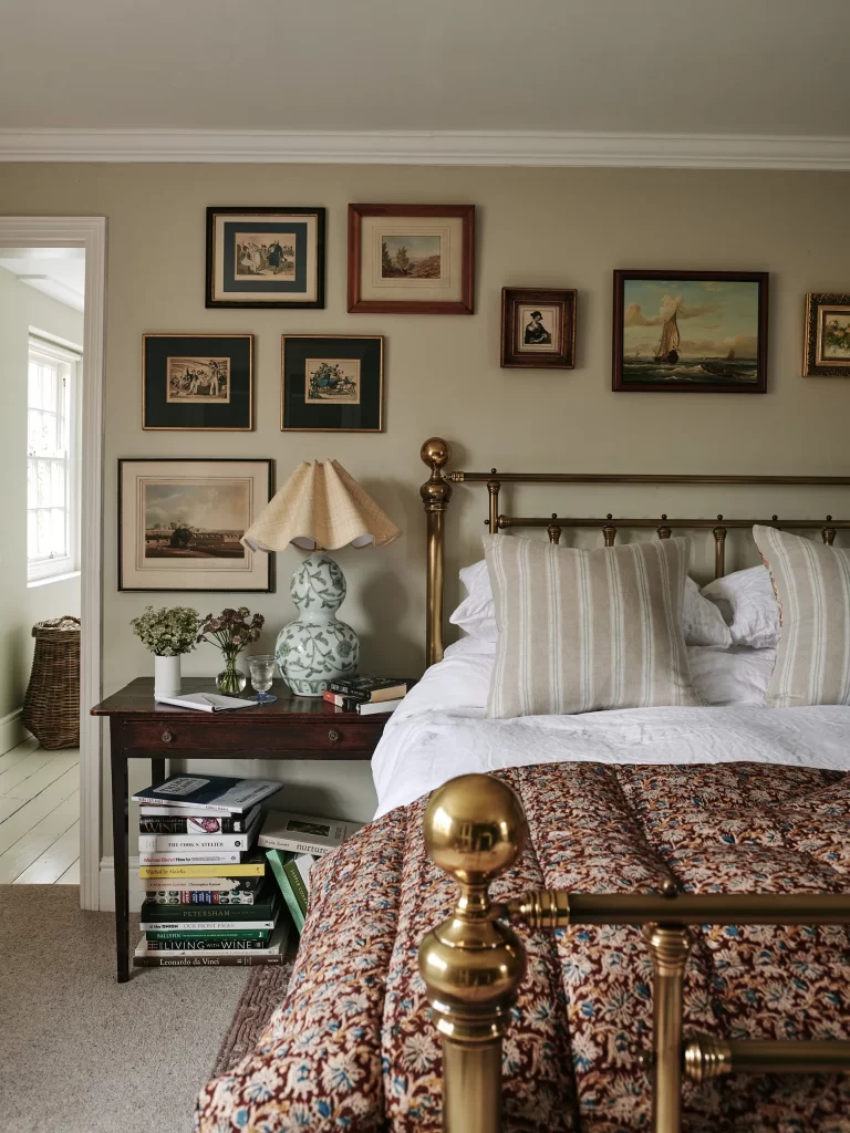 Antique metal bed frame used in a cottage bedroom