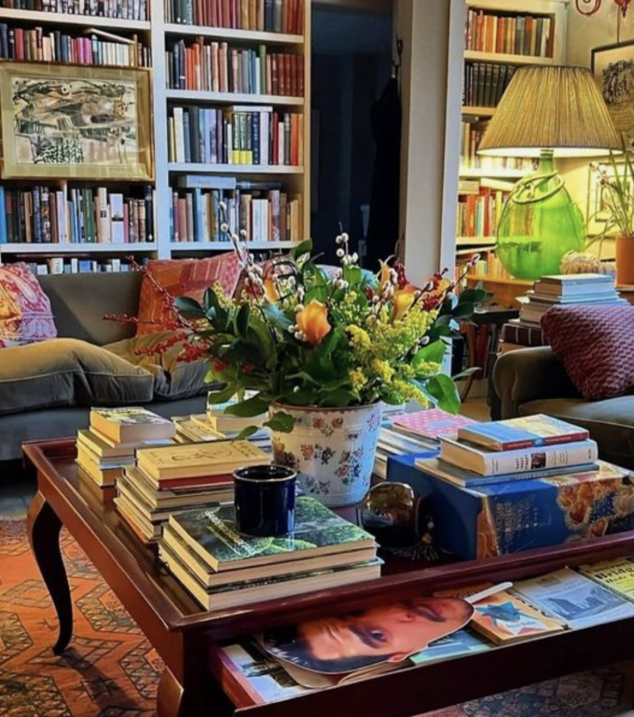 Classic coffee table filled with books and vintage vase