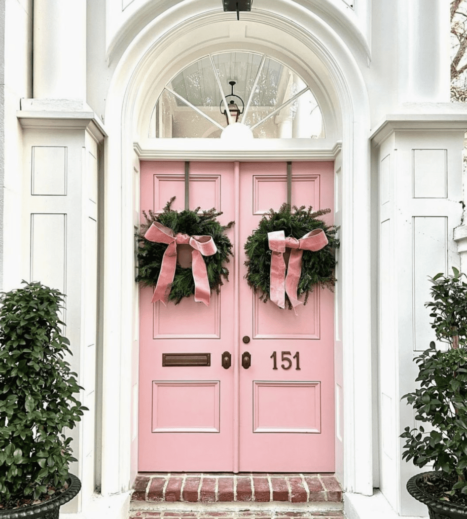 front door with double wreaths for decor