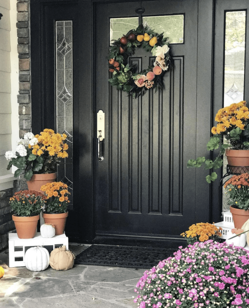 front door with stacked flower shelves