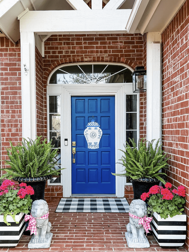 front door decor using mixed patterns in black and white