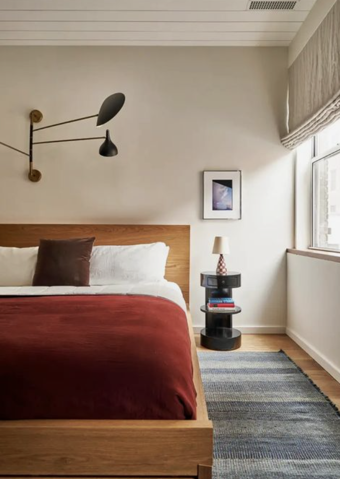 classic bedroom with statement chandelier above the bed