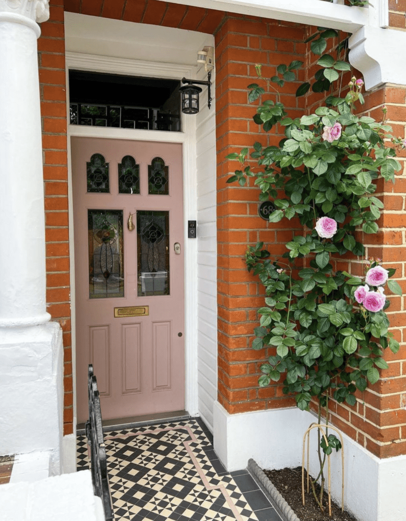 Entrance with a wall plant on the side to add a touch of green and beautiful flowers to front steps