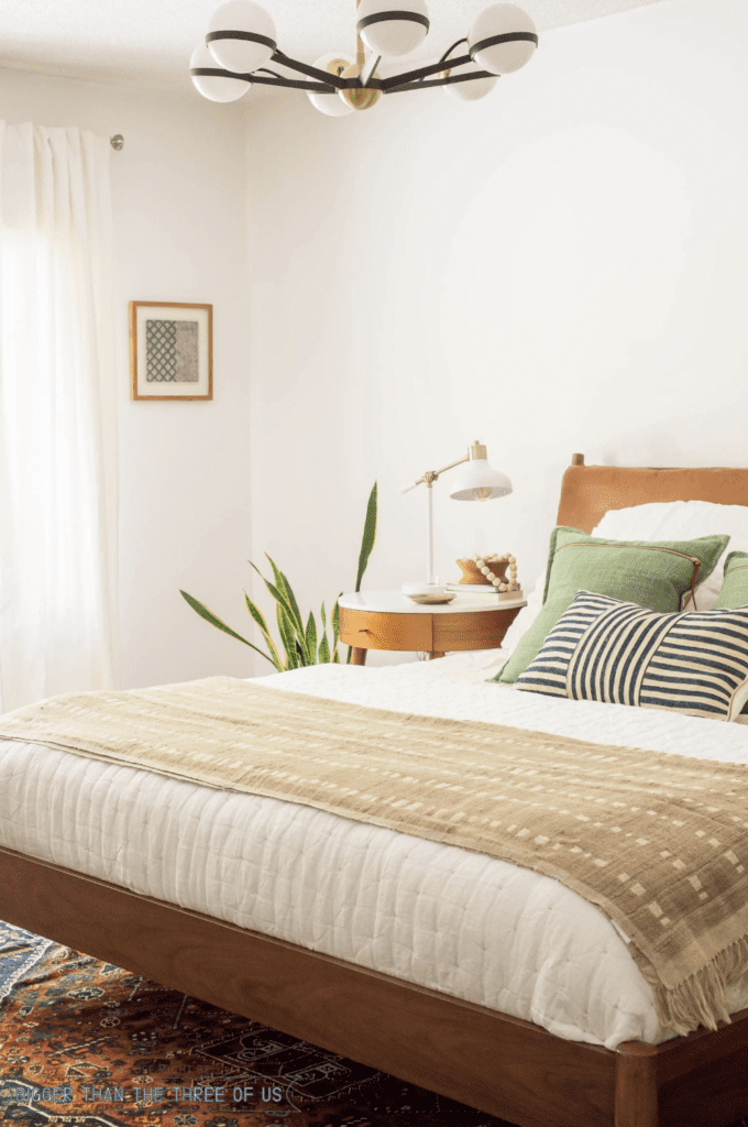 mid century bedroom with wooden vintage bed frame