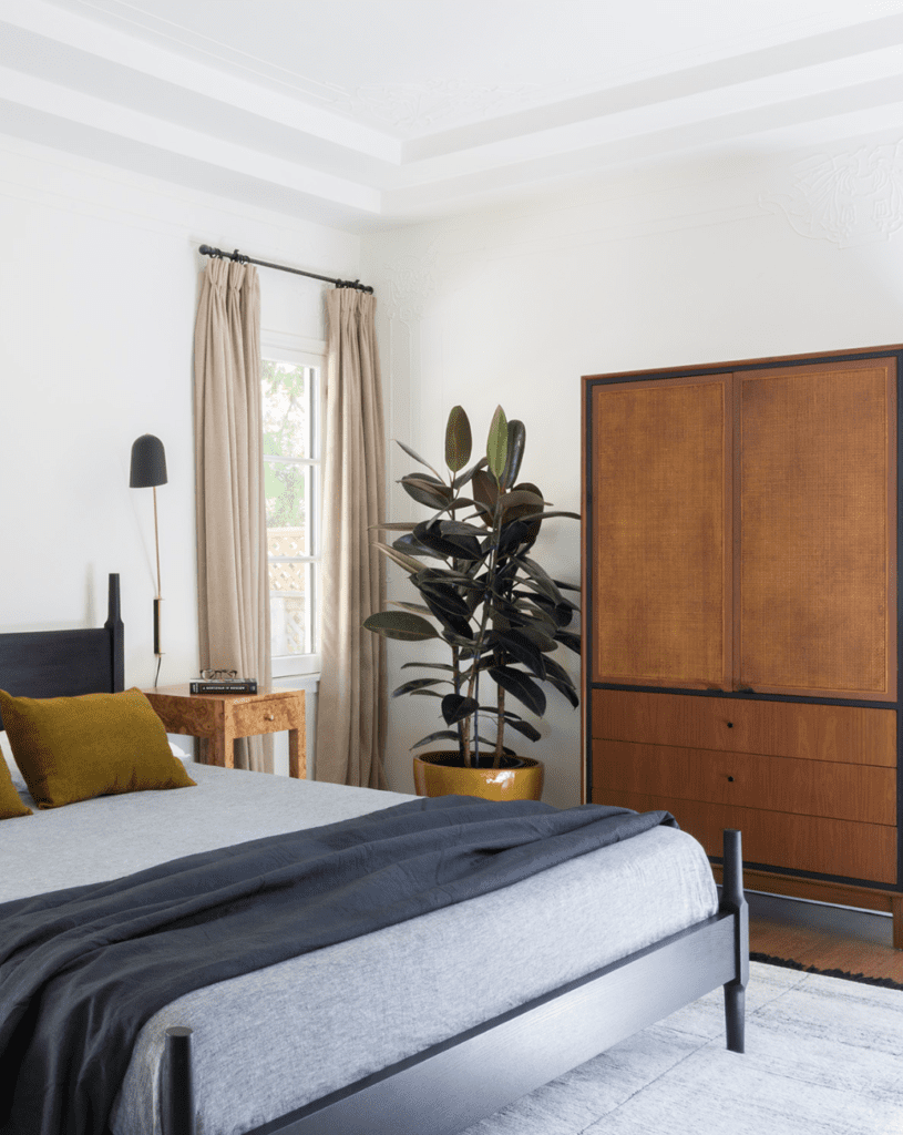 Wood vintage mid century wardrobe in a classic bedroom