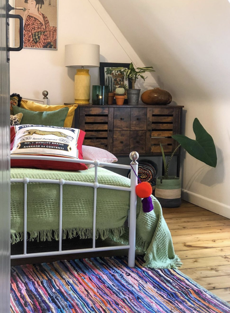 Large wood dresser that doubles as bedside table to save space