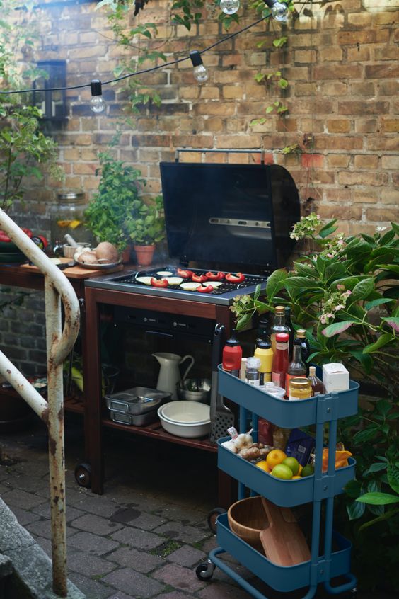 small outdoor kitchen using an Ikea cheap rolling cart with several tiers 