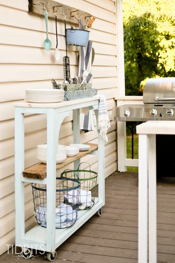 console table used as with grilling station for additional storage and counter space 