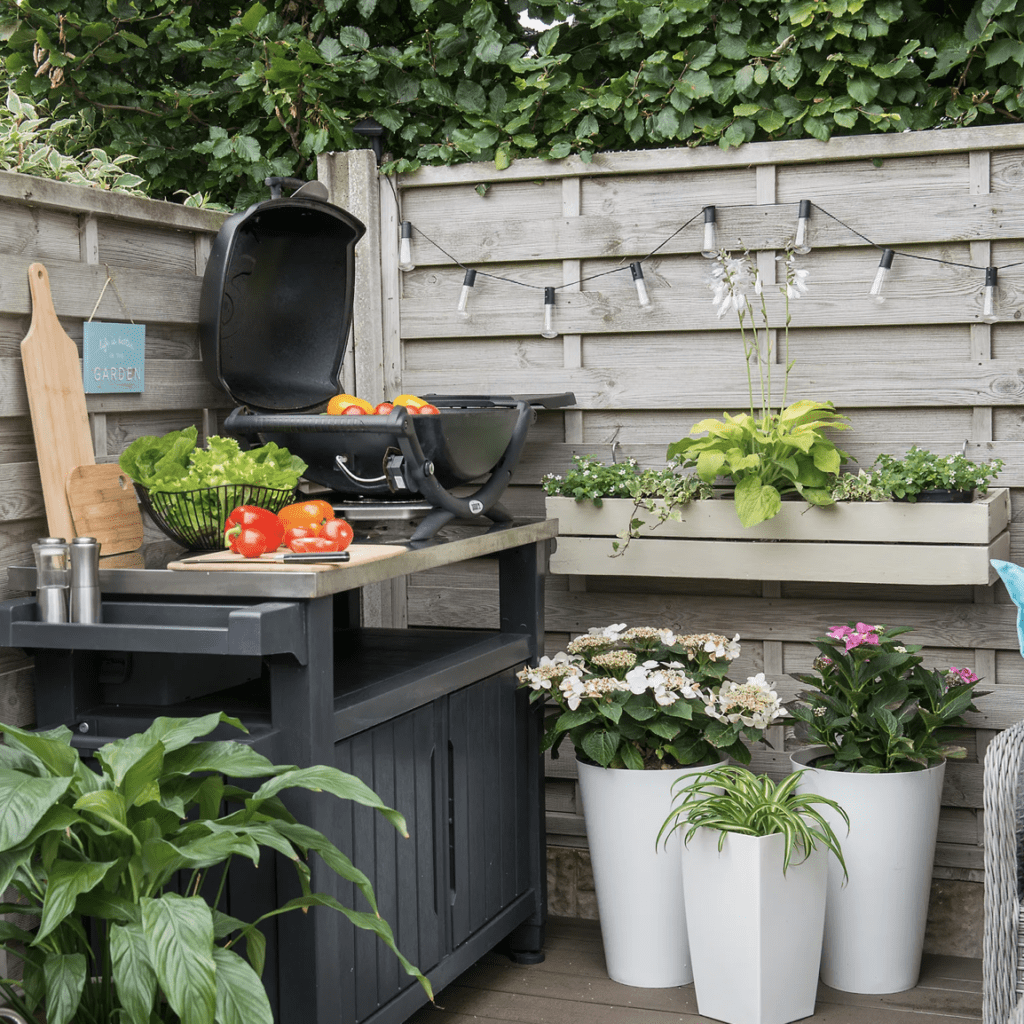 small outdoor kitchen using backyard corner to maximize space