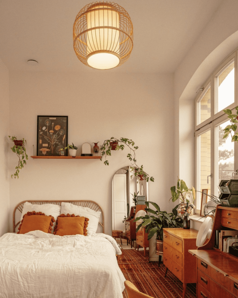 Wood display shelf used to decorate high ceilings in boho bedroom