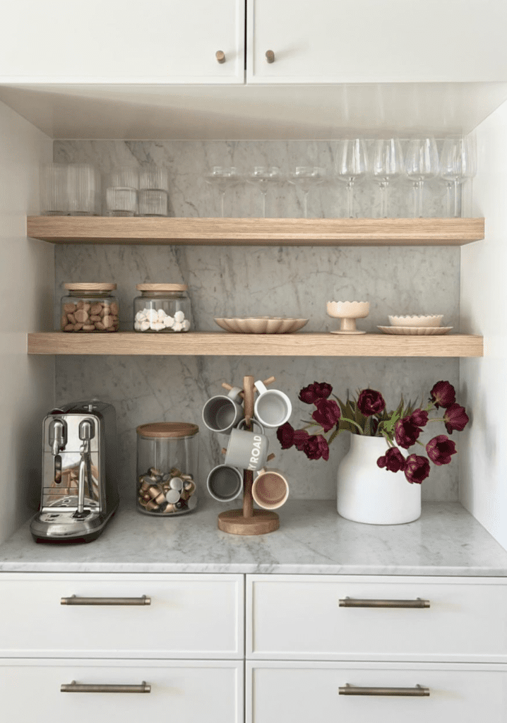 coffee corner with mugs hanging on display and a bouquet of flowers