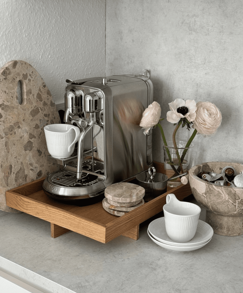 modern example of coffee bar ideas with an elegant wooden tray and marble coasters