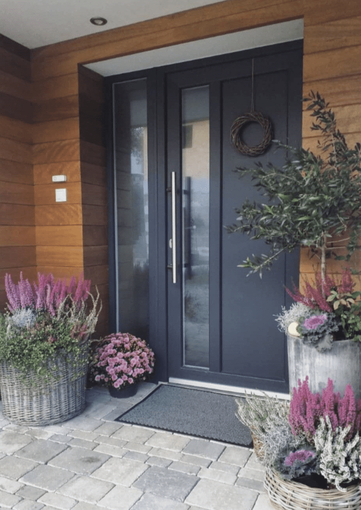 modern small front porch decor with colorful dried flowers and potted olive plant