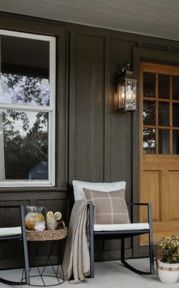 modern small front porch ideas with black metal chairs and minimalistic decor