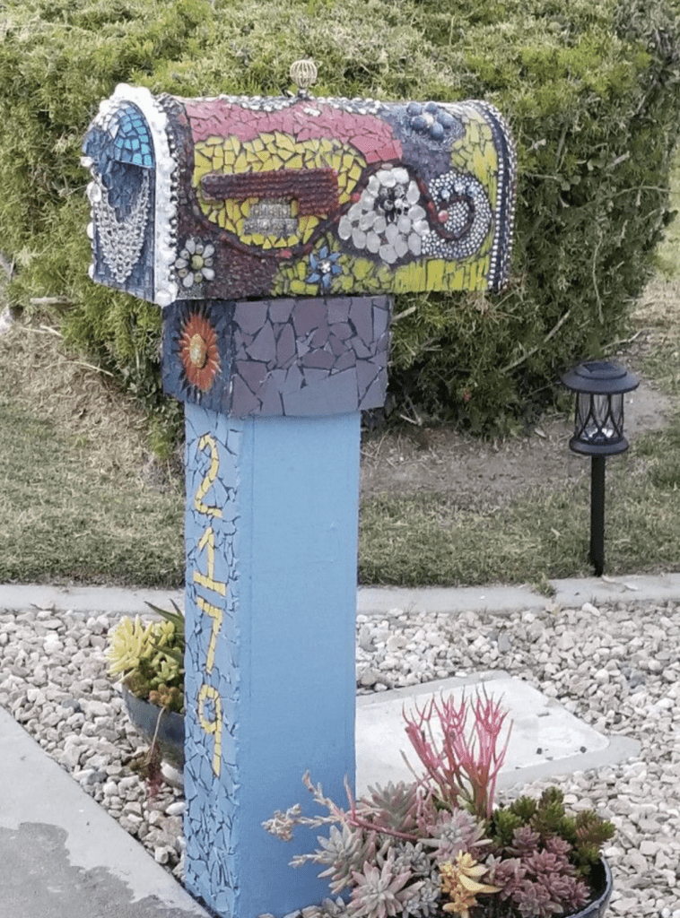 Mailbox ideas with mosaic decor to match bed rock landscaping