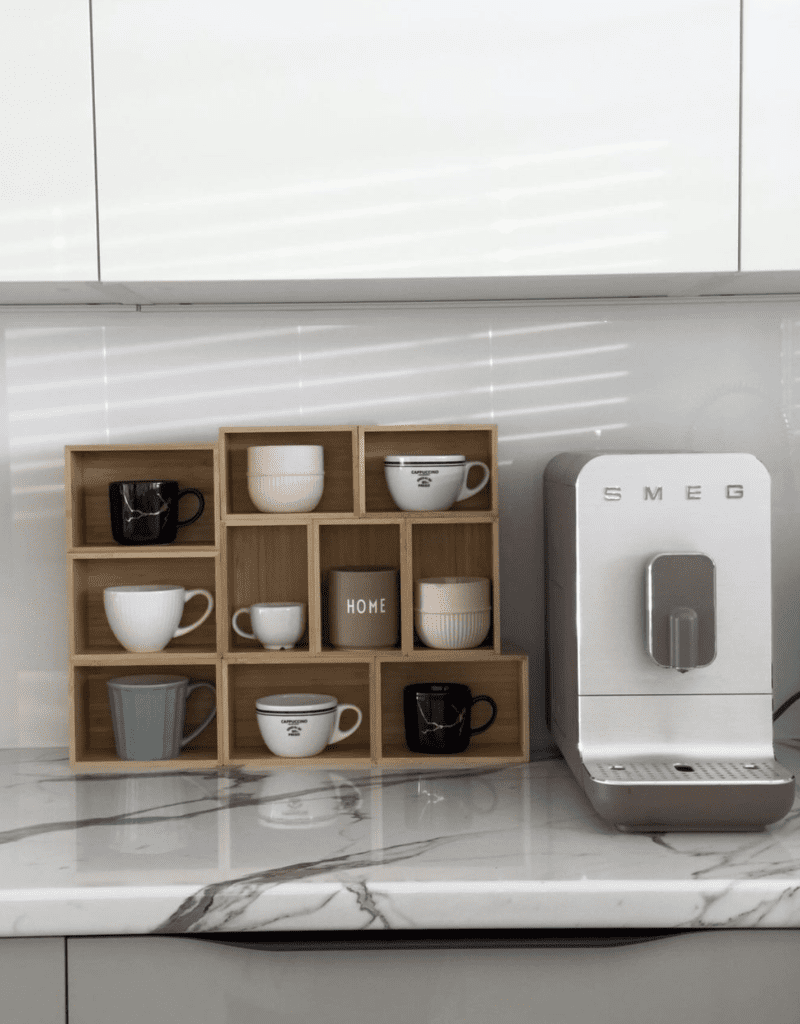 mugs on display in a coffee corner using block container