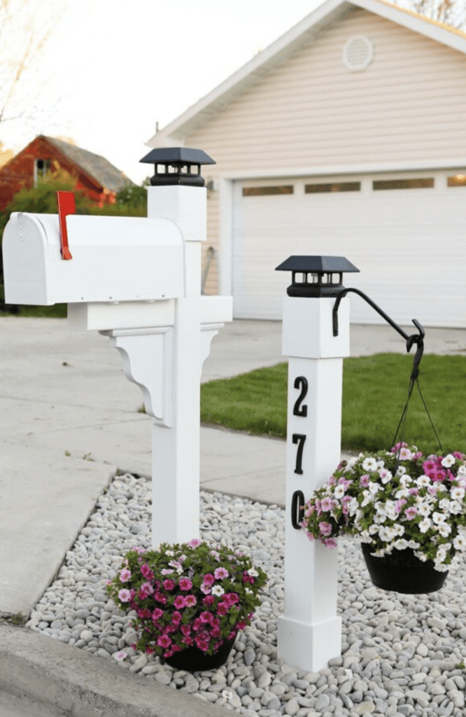 Nautical-inspired mailbox landscaping with pink and white flowers