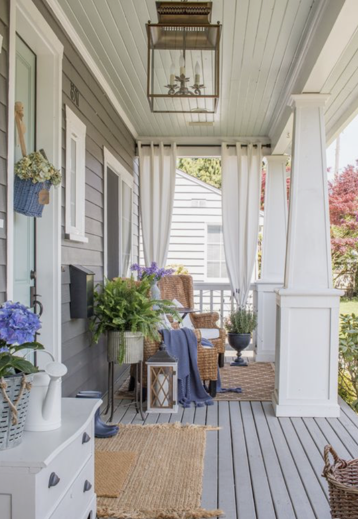 classic small front porch with curtains for privacy