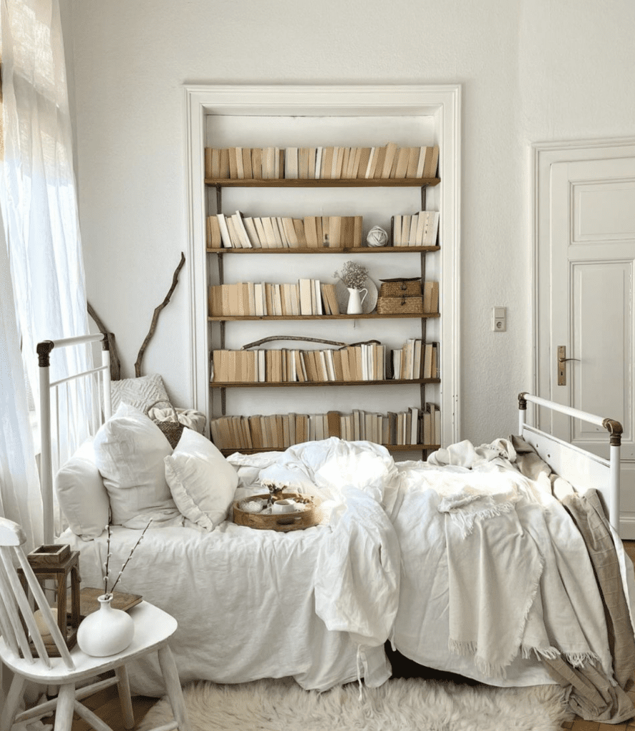 light-colored boho bedroom with chair used as bedside table