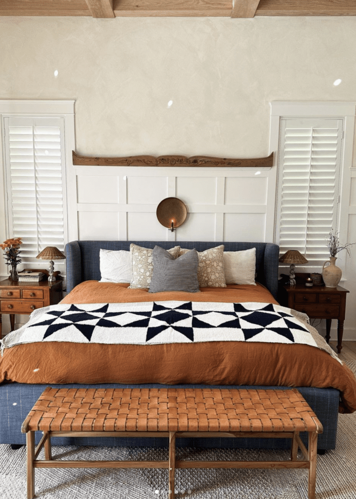 Traditional bed frame upholstered with classic pattern and paired with boho decor