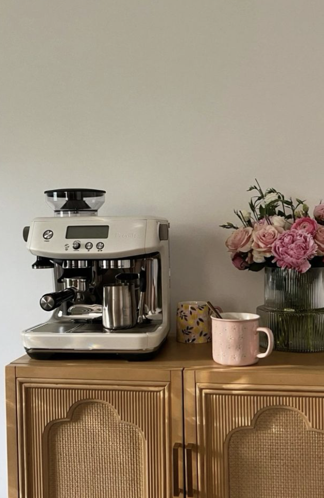 coffee machine on a vintage wicker dresser