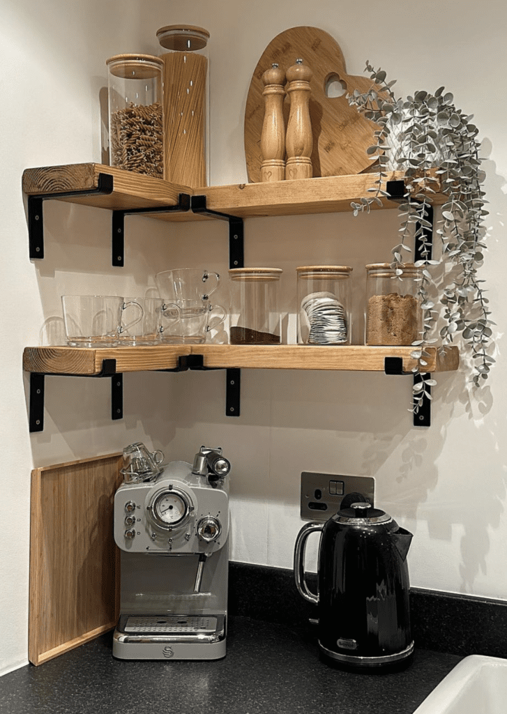 coffee corner with wooden wall-mounted shelves for containers