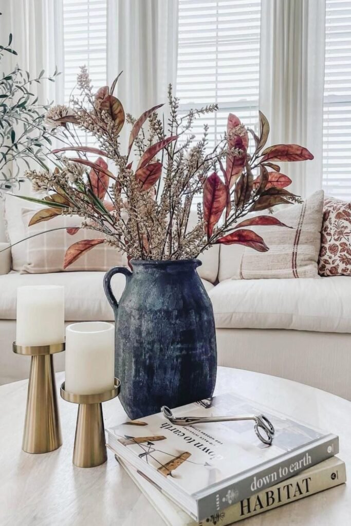 cozy autumn decor with candle and coffee